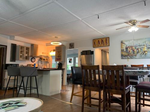 a kitchen and living room with a table and chairs at Cedar Island Xanadu in Kingsville