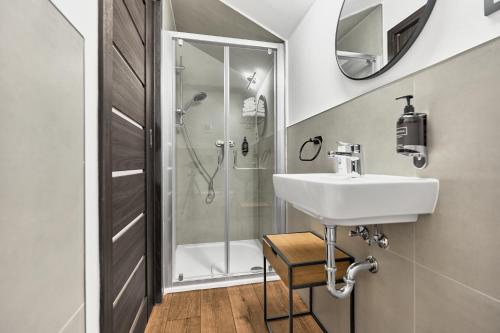 a bathroom with a sink and a shower at Plavírna in Otovice