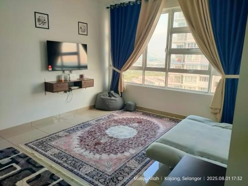 a living room with a couch and a tv and a window at Miftahul Raudhah Homestay in Kajang