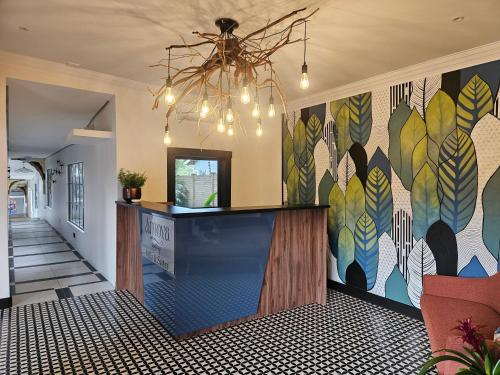 a lobby with a large mural on the wall at Amoya Villa in St Lucia