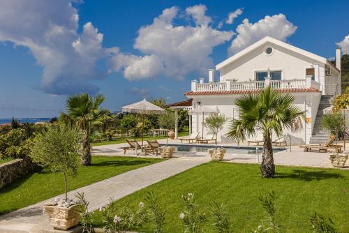a villa with a swimming pool and a resort at Pantheon Villa Svoronata in Svoronata