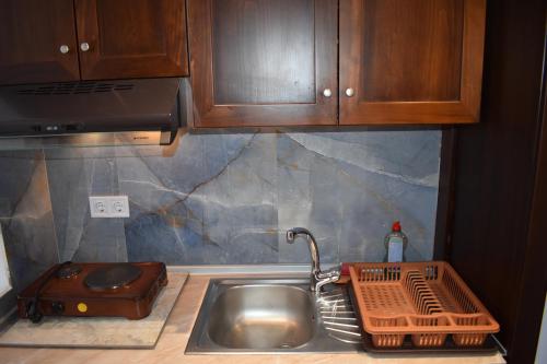 Kuchyň nebo kuchyňský kout v ubytování Thalassion Rooms
