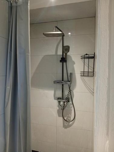 a bathroom with a shower with a basketball hoop at Sadba Beach 