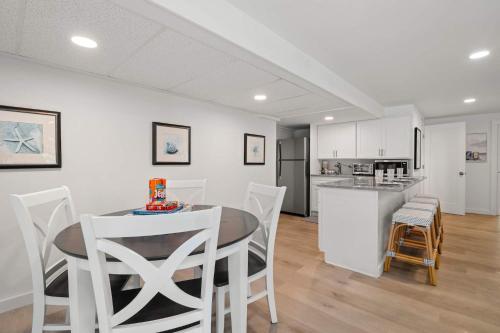 a kitchen and dining room with a table and chairs at Sprawling Home 1 Mi to Downtown in Harwich