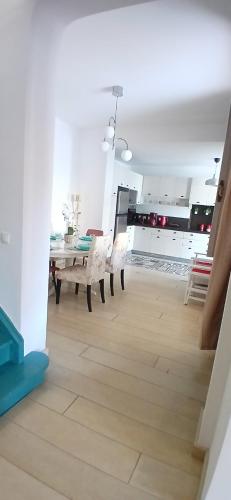 a dining room with a table and chairs at Σπίτι - Κάστρο πάνω από τη θάλασσα in Piraeus