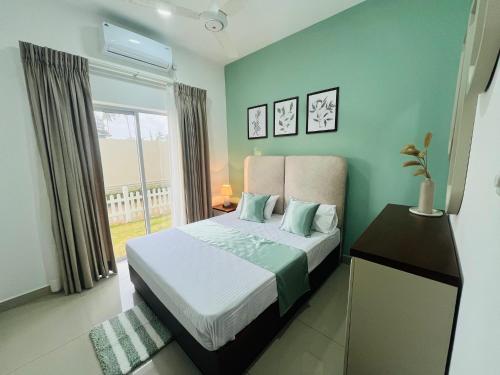a bedroom with a bed and a window at UrbanEdge Negombo Resort Apartment in Negombo