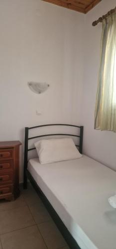 Ένα ή περισσότερα κρεβάτια σε δωμάτιο στο Lemi Apartments
