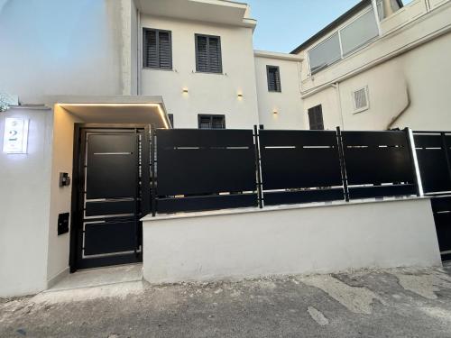 a black gate in front of a building at Dimora Luminè in Naples