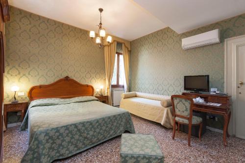 Posteľ alebo postele v izbe v ubytovaní B&B Al Palazzetto