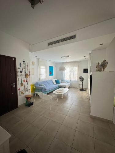 a living room with a couch and a table at Villa Serenity in Protaras