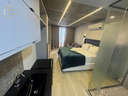 a hotel room with a bed and a sink at LM Setai Yacht Cabo Branco in Tambaú