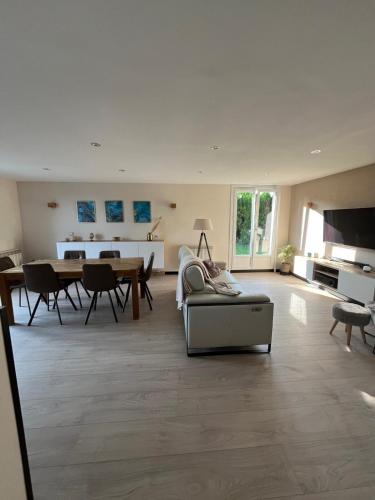 a living room with a couch and a table at Au coeur du Ried 