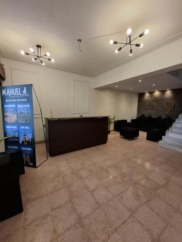 a large room with a stage and a podium at Hotel Alameda in Mendoza