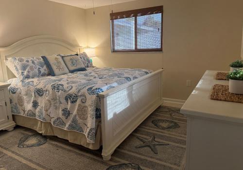 a bedroom with a bed and a window at Canal Home Dearborn-Indian Mound in Englewood