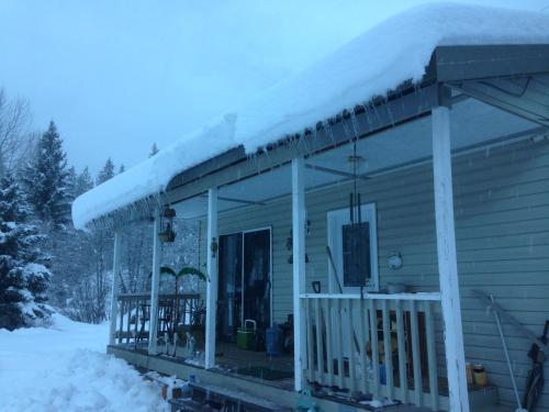 a house with snow on top of it at Witt's End Ranch Private Get Away in Princeton