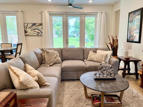 a living room with a couch and a table at Dora's Heart New 3br King Bed Brand New in Mount Dora