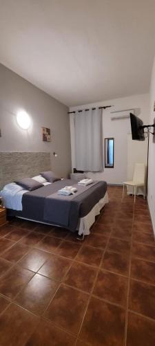 Ένα ή περισσότερα κρεβάτια σε δωμάτιο στο La Mimosa