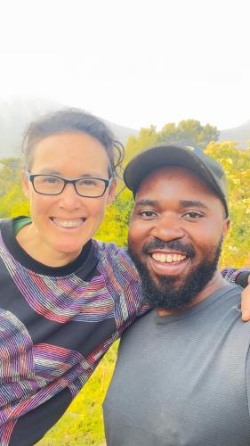 a man and a woman posing for a picture at Kibugu Gorilla Homestay in Kisoro