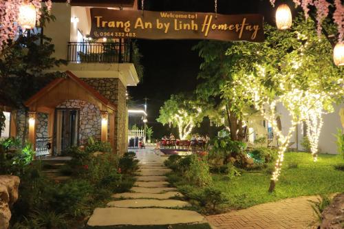 a walkway in front of a building at night at Trang An by Linh Homestay in Nguyên Ngoại