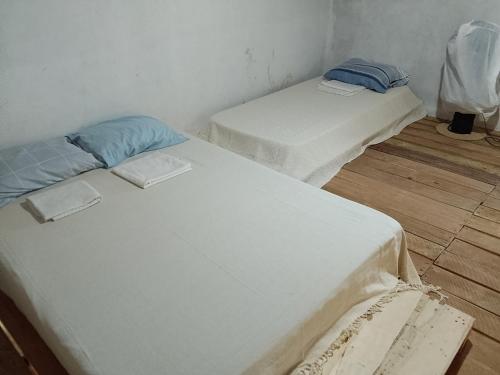 Ένα ή περισσότερα κρεβάτια σε δωμάτιο στο Casa mahalo atalaia wi-fi