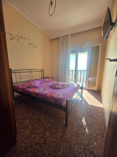 Postel nebo postele na pokoji v ubytování Beachfront Apartment Thassos