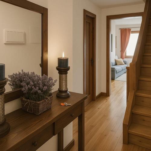 a living room with a candle on a table at Apartamento Duplex Esterri ideal para familias in Esterri d'Àneu