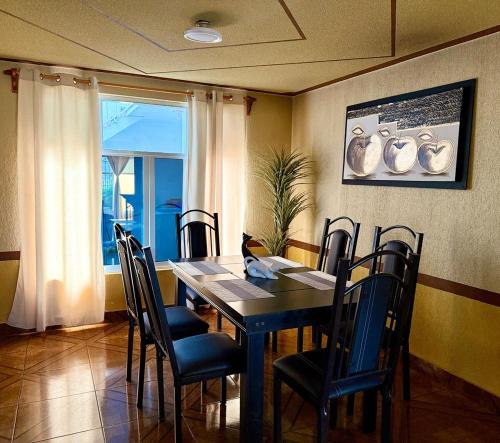 a dining room with a table and chairs at Residence in Chignahuapan in Chignahuapan