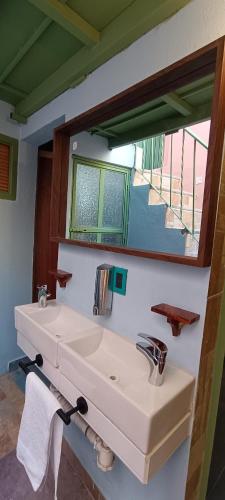 a bathroom with a white sink and a mirror at Casa Tuna in Querétaro