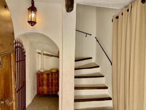 a hallway with a staircase in a house at Cabris Village - Elegant Family House in Cabris