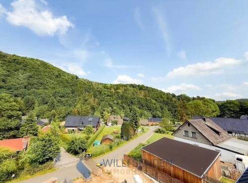 an aerial view of a village with houses and trees at Ferienwohnung Waldblick 2 für 4 Personen und max 2 Hunde in Simmerath