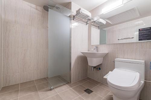 a bathroom with a toilet and a sink at Pyeongtaek Stay Tourist Hotel in Pyeongtaek