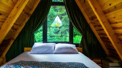 Postel nebo postele na pokoji v ubytování Dreamy Life Bungalow