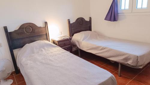 Кровать или кровати в номере Hoyo 1 Apartamento Deluxe penthouse golf con piscina