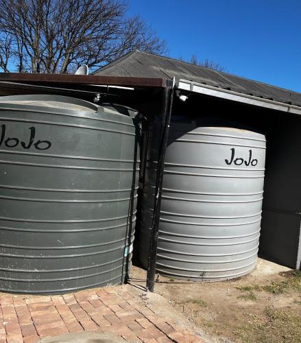 two grey barrels sitting inside of a garage at Private 4 Double Room Guest Wing, Comfortable, Secure Parking, Wi-Fi, Ensuite Bath in Ermelo