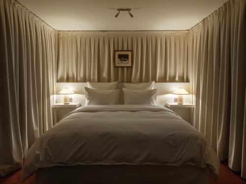 Postel nebo postele na pokoji v ubytování Numero cent