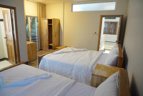 Postel nebo postele na pokoji v ubytování Sok Heng Guesthouse