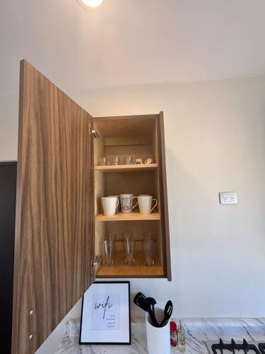 a cupboard with a piece of paper in it at Vinedos del Mar 2BR 2BA with pool in Ensenada