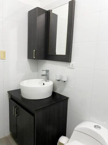 a bathroom with a sink and a toilet at Enjoy a 2 bedroom 2 bathroom apartment in Bella Vista in Porlamar