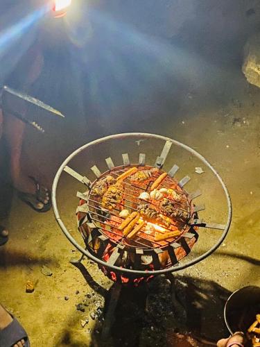 a grill with many different types of food on it at Exciting Tree house and 2 Chalets, Spring valley farm stay Buttala, Okkampitiya 