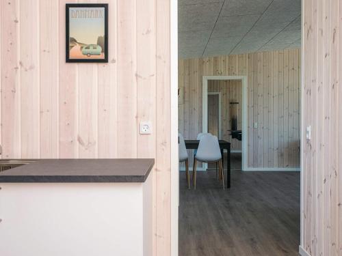 a room with a table and a picture on the wall at 5 star holiday home in Grenaa in Brøndstrup