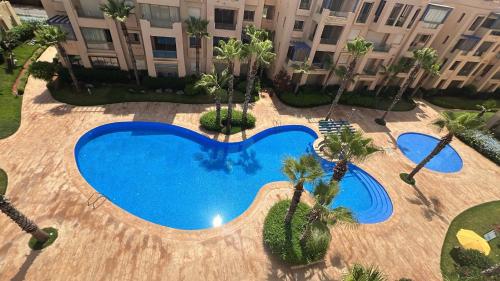 Bassein majutusasutuses Vue piscine et accès rapide à la plage või selle lähedal