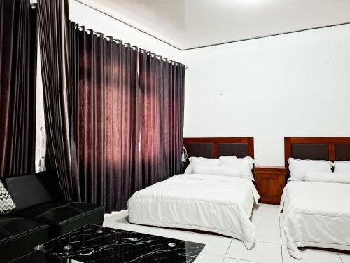 Katil atau katil-katil dalam bilik di Hotel Green View near Sarangan Lake RedPartner