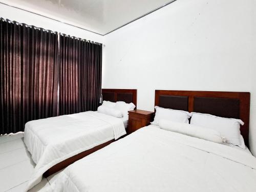 Katil atau katil-katil dalam bilik di Hotel Green View near Sarangan Lake RedPartner