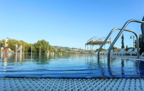 a swimming pool with a slide in the water at Casa Giudice in Chiaramonte Gulfi