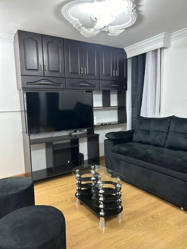 a living room with a couch and a table at Luxurious Stay 2 in Bello
