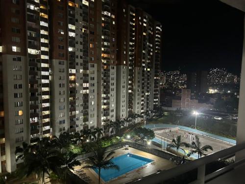 a view of a pool from a balcony at night at Luxurious Stay 2 in Bello