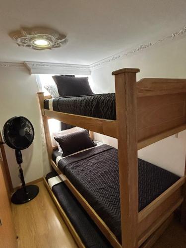 a room with three bunk beds in a room at Luxurious Stay 2 in Bello