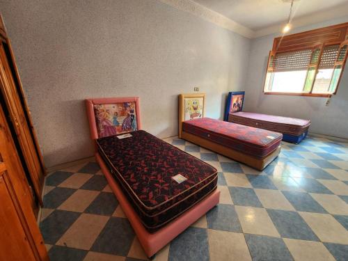 Postel nebo postele na pokoji v ubytování Ets koudane