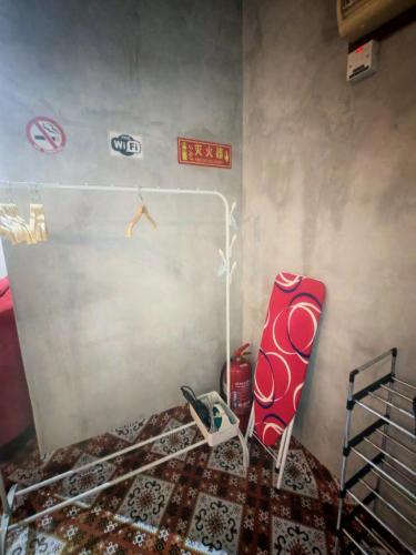 a bedroom with a bed and a bed frame in a room at Defaso Homestay Kota Marudu in Kampong Karungkon