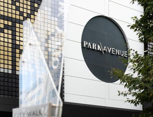 a sign in front of a park hyundai building at New High Floor Apartment in the heart of Canberra in Canberra